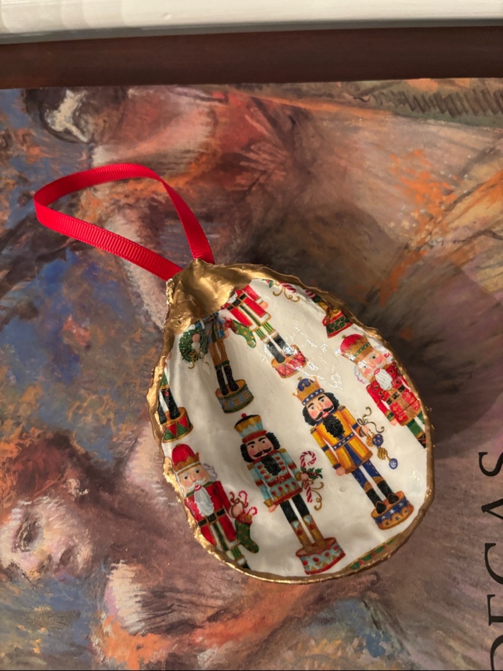 Holiday Christmas Nutcracker Oyster Shell Ornament in Red and Gold